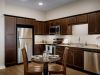 The Claiborne at Newnan Lakes senior apartment full kitchen with high-end design and appliances