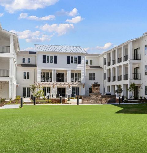 The Claiborne at Newnan Lakes exterior view of senior community courtyard