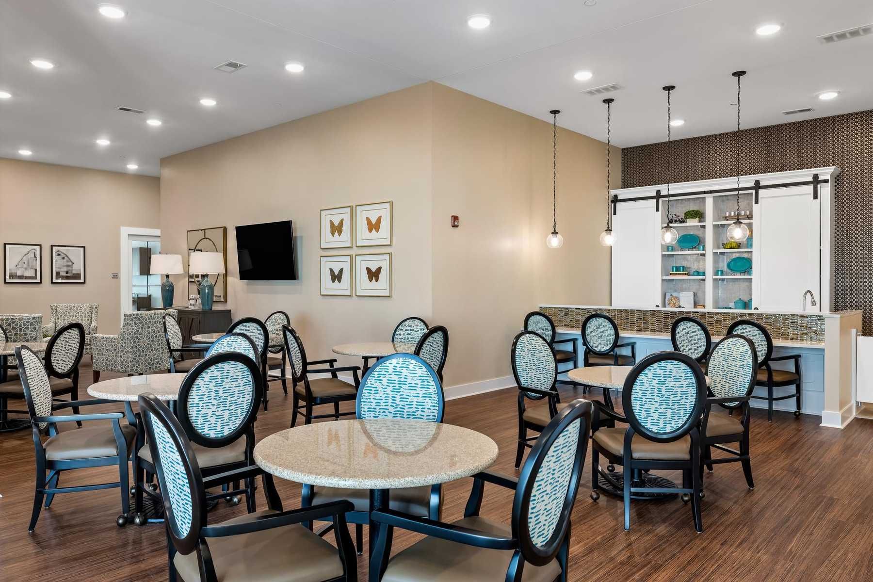 The Claiborne at Newnan Lakes employee walking with senior resident