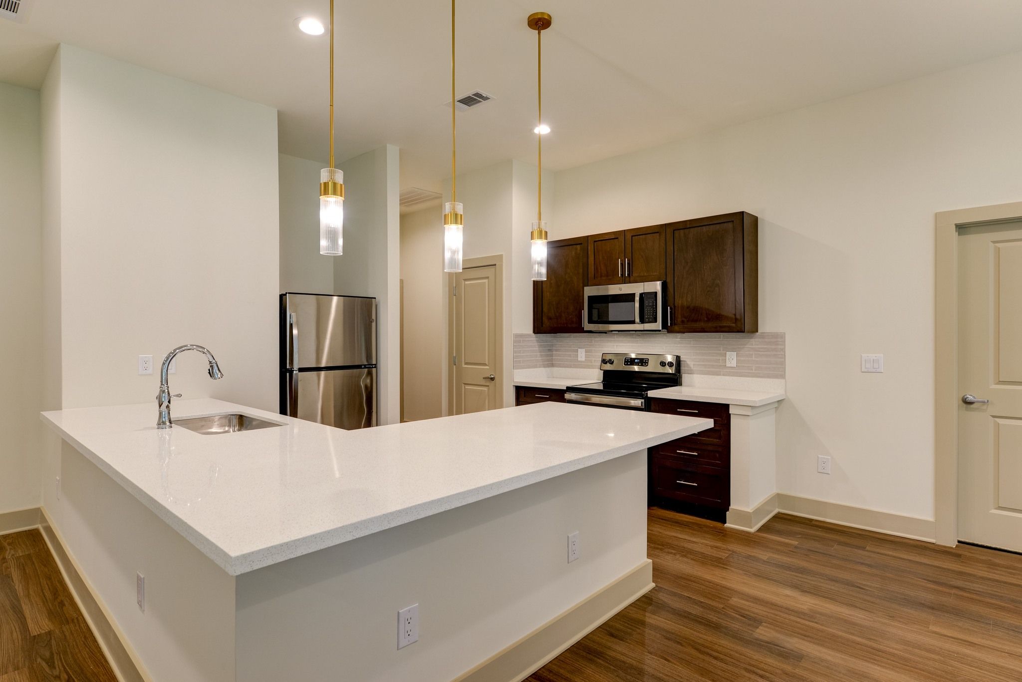 The Preserve at Meridian senior apartment full kitchen with high-end design and appliances
