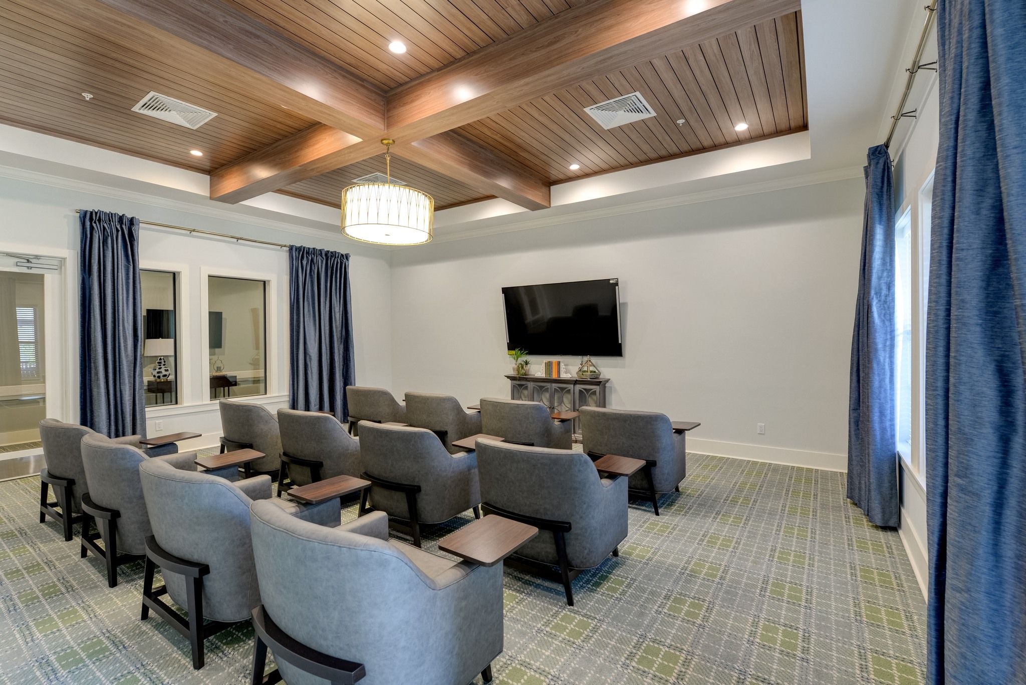 The Preserve at Meridian senior living community movie theater with big screen and surround sound