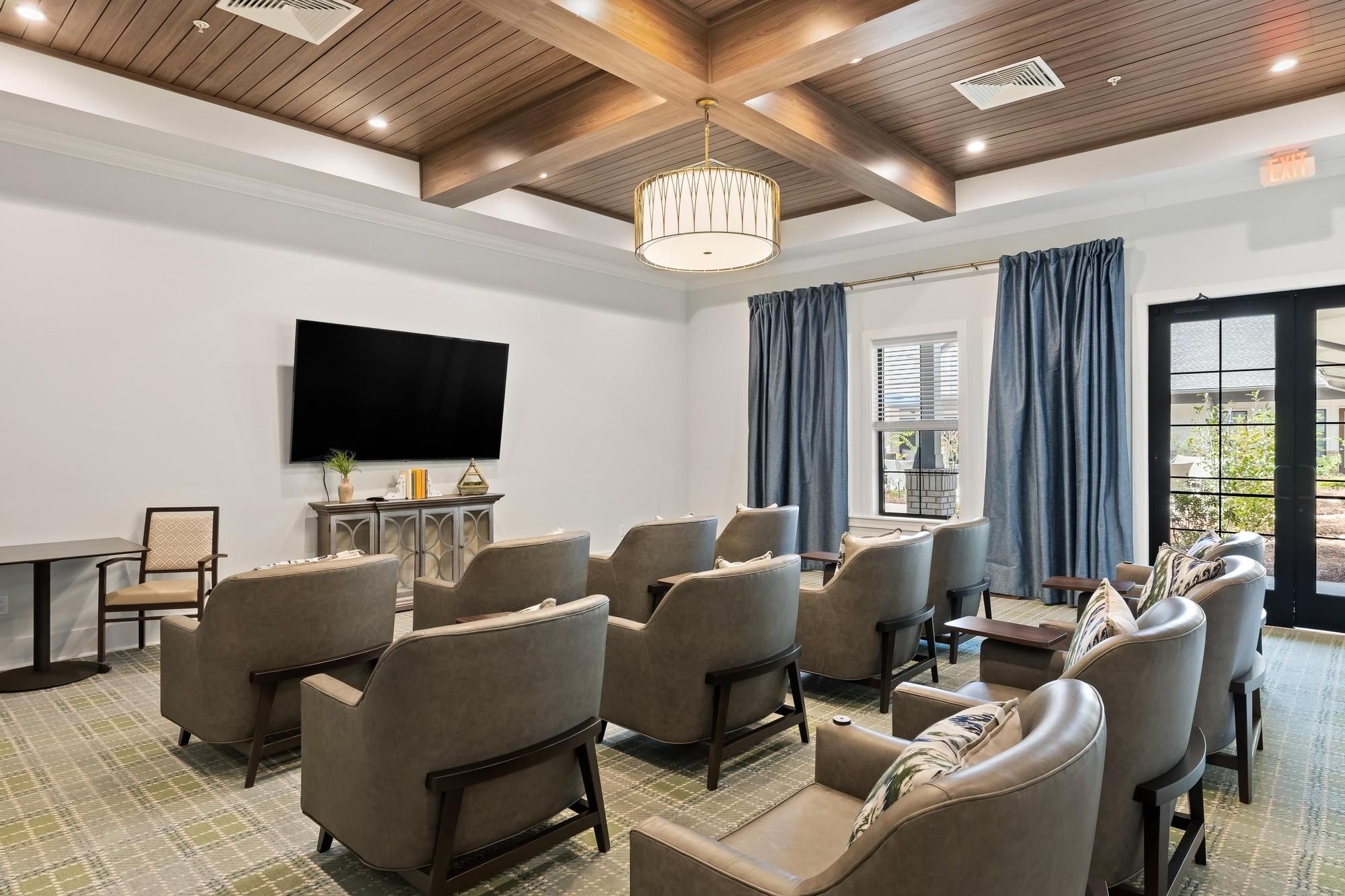 The Preserve at Meridian senior living community movie theater with big screen and surround sound