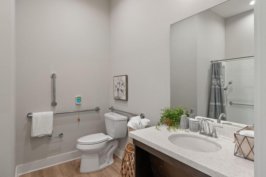 The Preserve at Meridian senior living community memory care bathroom with accessibility features including handrails and zero-entry shower