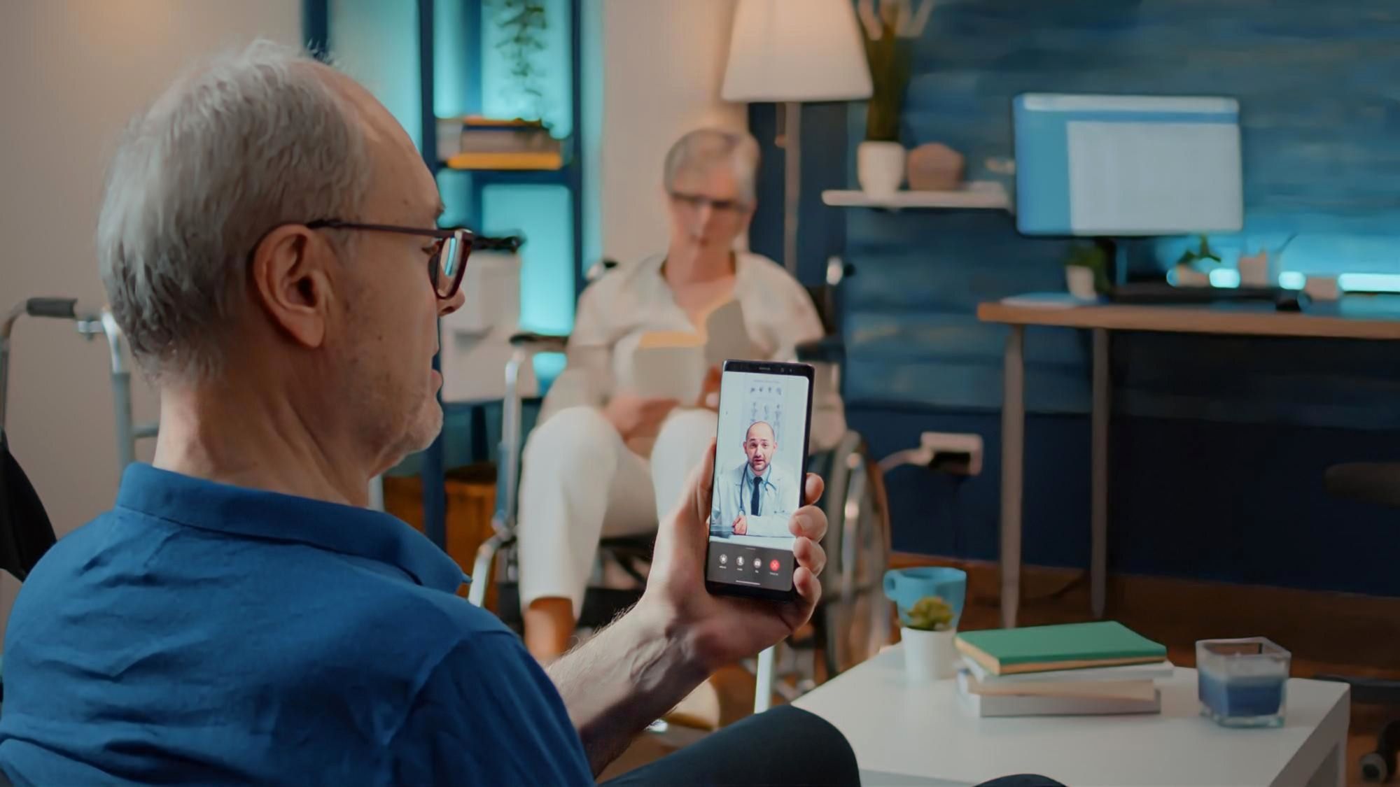 A senior man on a virtual telehealth visit with a doctor