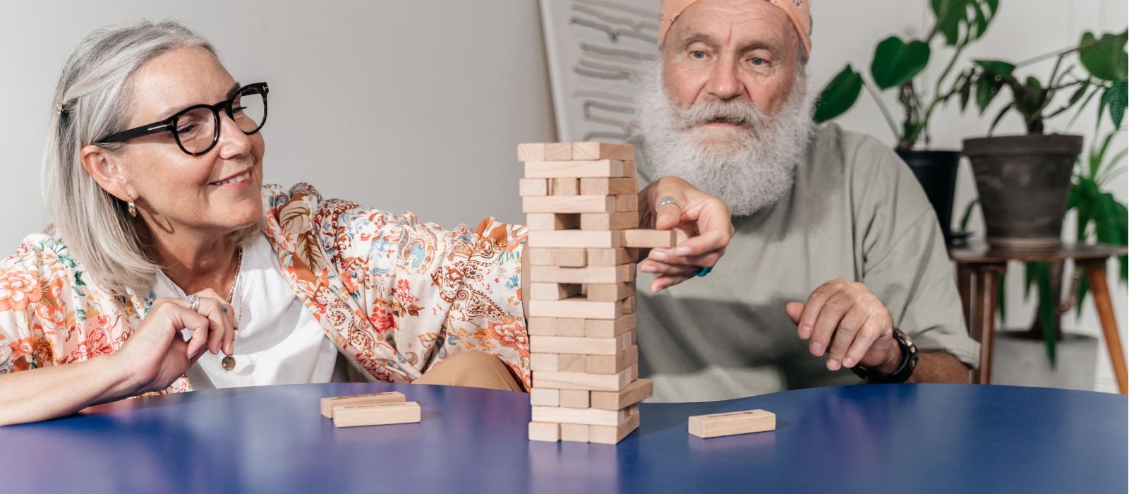 Senior couple playing Jenga.