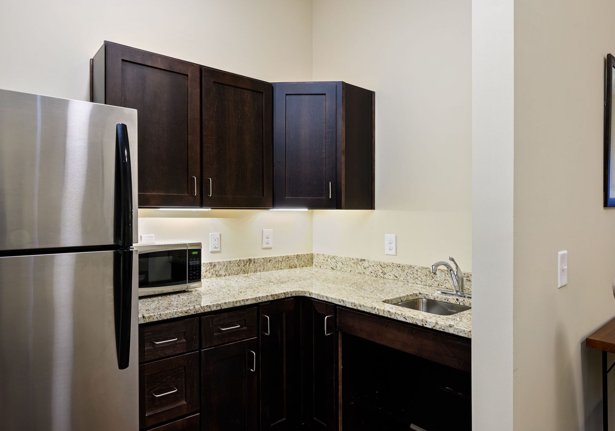 The Claiborne at Shoe Creek senior living community kitchenette with high-end finishes