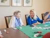 The Claiborne at Simpsonville senior resident and employee laughing together