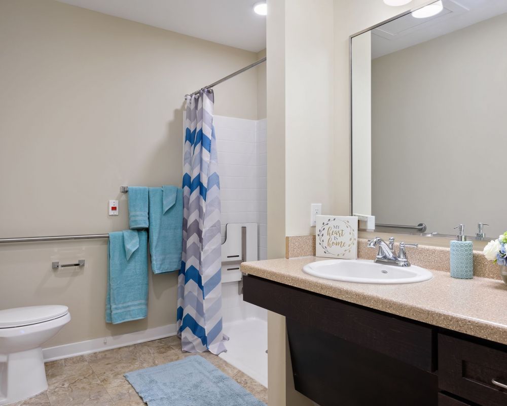 The Claiborne at Simpsonville senior living community full kitchen and living area