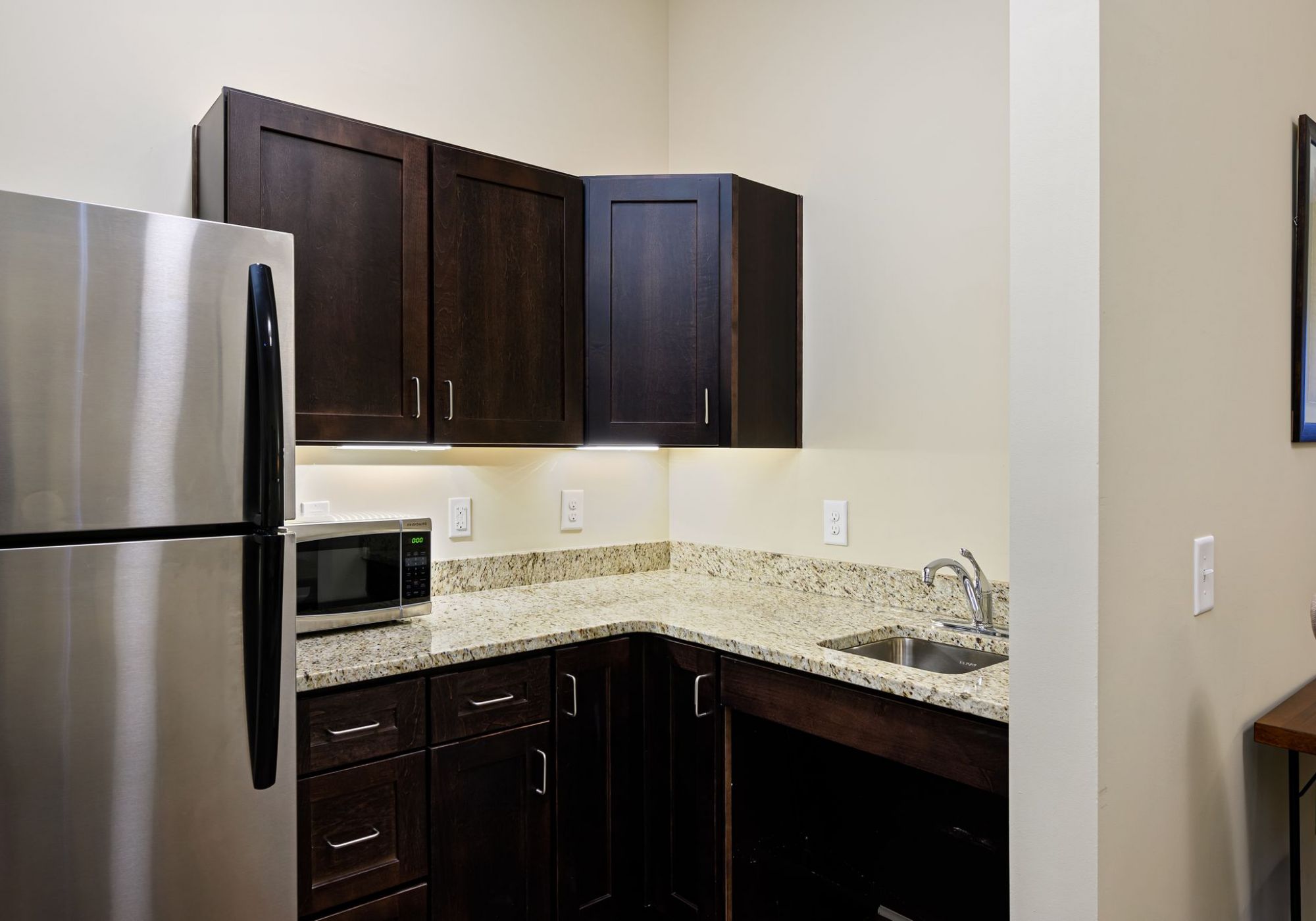 The Claiborne at Simpsonville senior living community kitchenette with high-end finishes