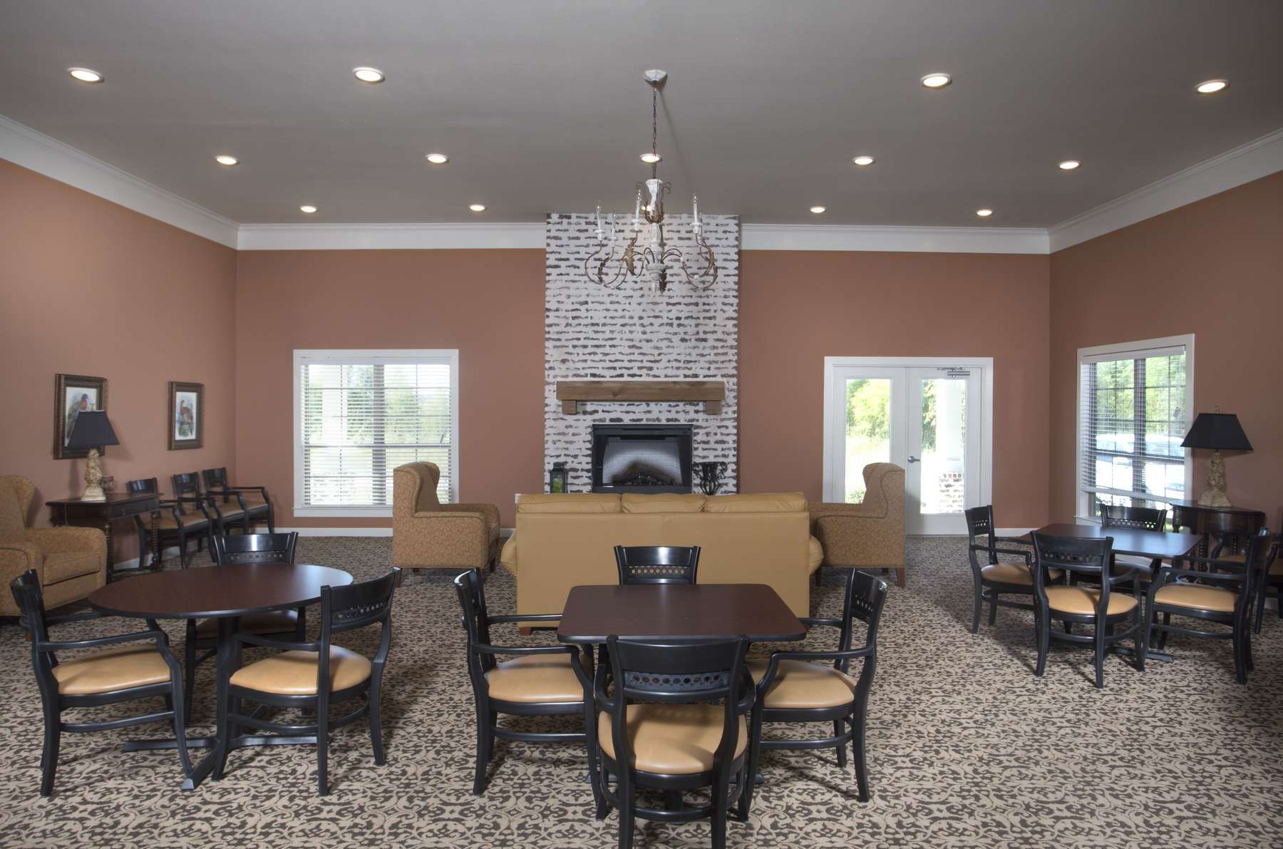 The Claiborne at Thibodaux room with seating and fireplace