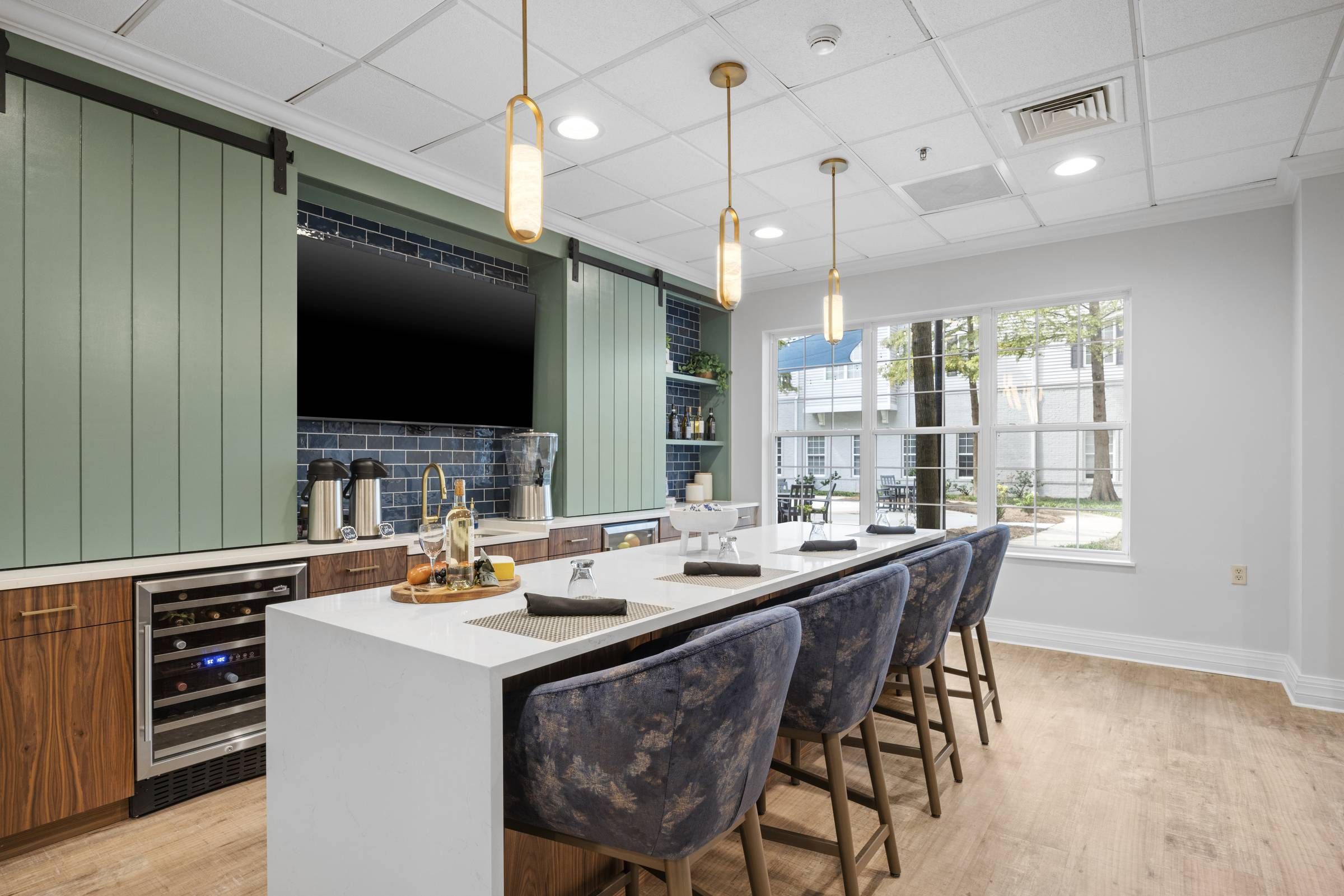 The Claiborne at Thibodaux employee walking with senior resident