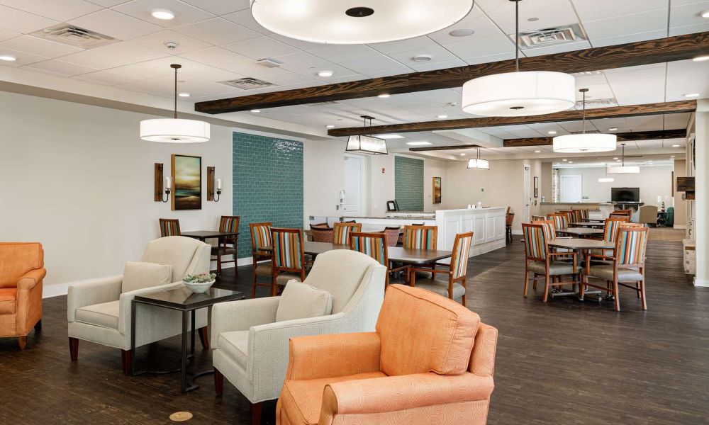 The Claiborne at West Lake memory care dining and seating area