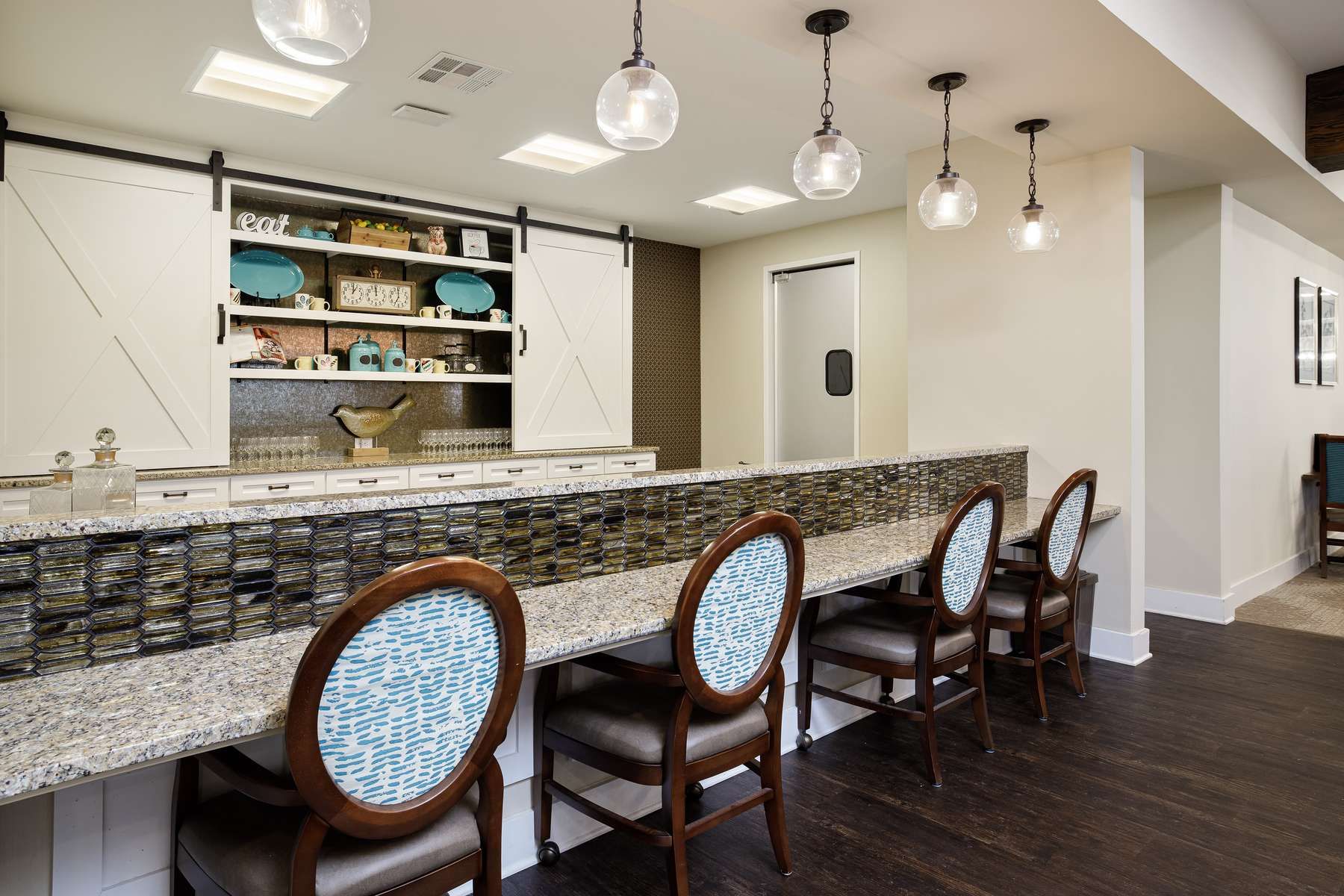 The Claiborne at West Lake employee walking with senior resident