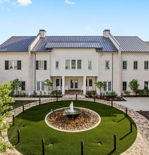 The Claiborne at West Lake exterior view of senior community courtyard