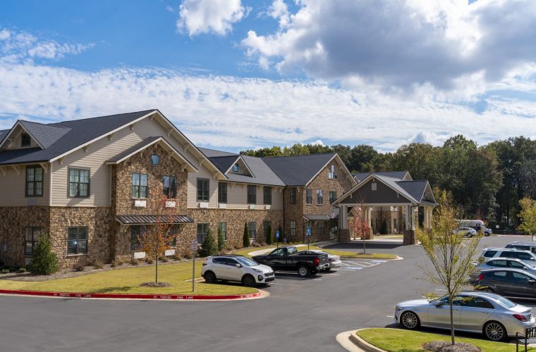 Exterior view of Brickmont at John's Creek senior living community by Claiborne.