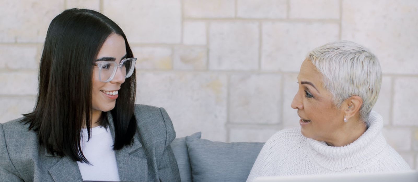 Two women facing each other in conversation