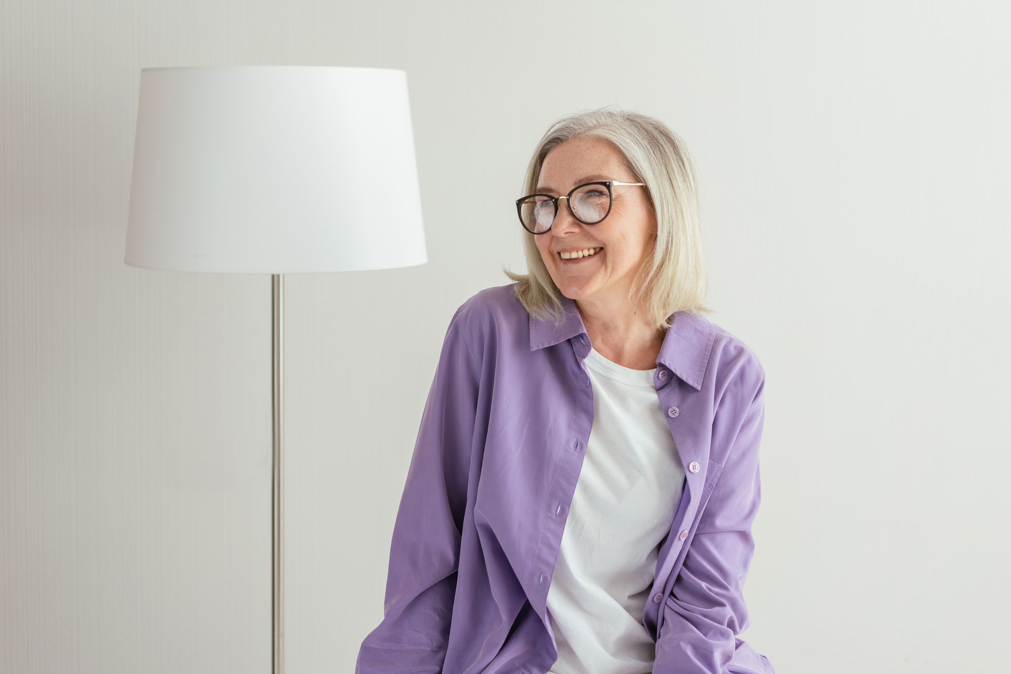 Smiling senior woman with glasses portrait.